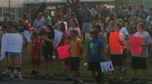 Students and parents rally outside of Merrick Avenue Middle School on Wednesday, July 24, 2013.