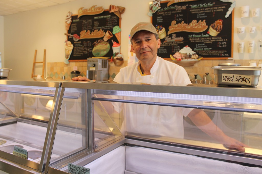 Dan Levine mixes up more than 100 flavors at Five Pennies in Rockville Centre, a cozy ice cream shop in the heart of the village's shopping district.  (Rashed Mian/Long Island Press) 