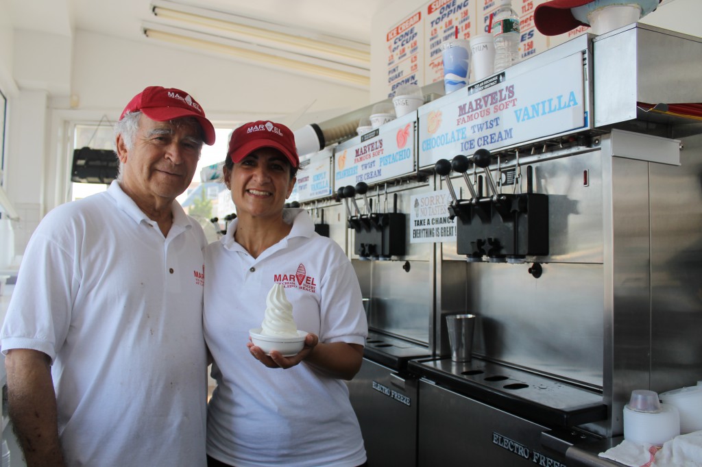 Arthur Katsafouros (left) and Pauline Seremetis (right) are glad to be serving their cold treats again after Sandy nearly destroyed the popular ice cream shop in Lido Beach. (Rashed Mian/Long Island Press) 