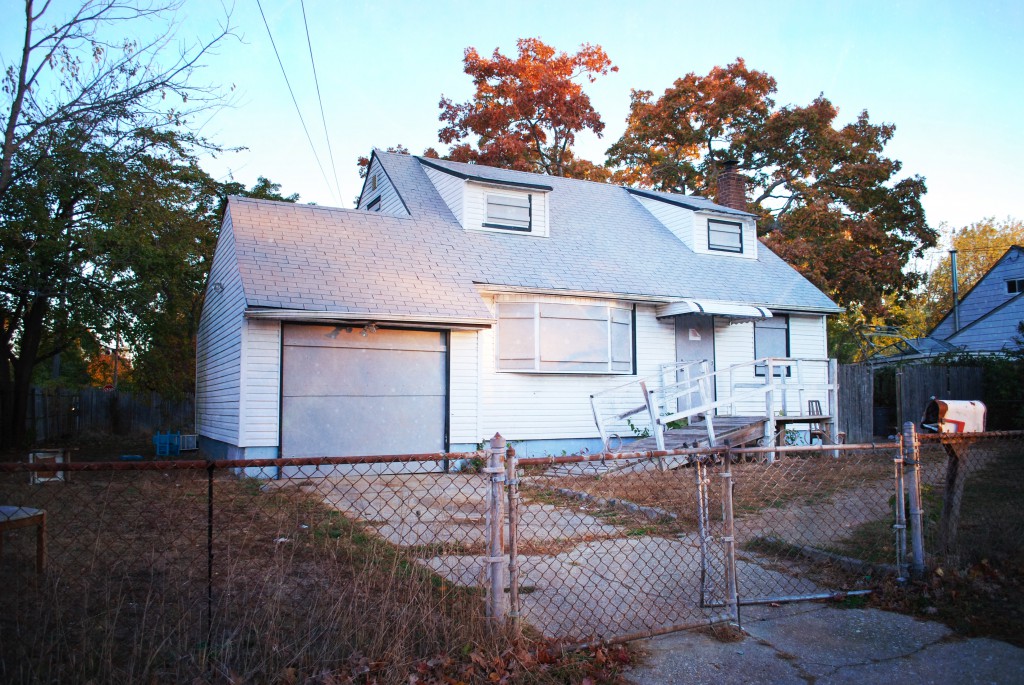 Authorities recently boarded up this  vacant house on Ackerman Street in Central Islip, where drugs and prostitution were rampant, to the shagrin of neighbors with young children who live nearby.
