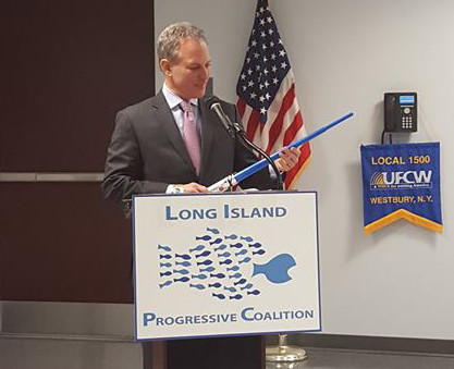 New York State Attorney General Eric Schneiderman shows off a toy light saber. 