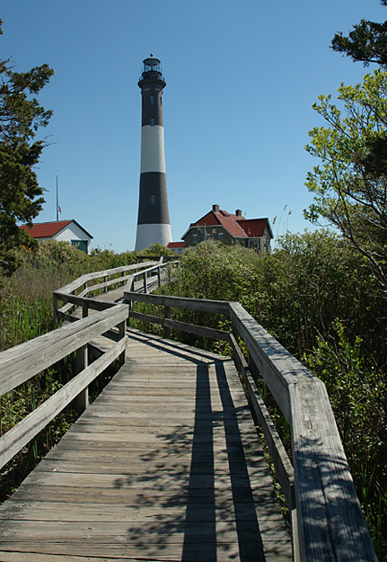 FIRE IN THE SKY: Some believe the Fire Island Lighthouse, which has aided the navigation of countless seafaring vessels for more than 150 years, to also be a beacon for wayward spirits. (Timothy Bolger / Long Island Press)