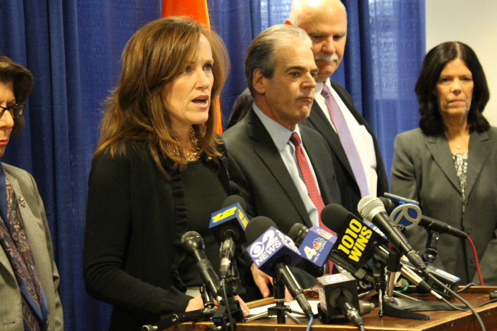 Nassau County District Attorney Kathleen Rice at press conference announcing arrest of 17 men in scrap metal scam. 