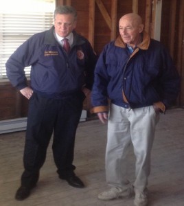Nassau County Executive Ed Mangano, left, and Larry Elliott, 85, inspect Elliot's moldy Seaford home Tuesday.