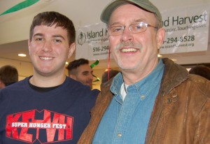 Adelphi University fraternity leader Alex Lucks, left, and Jim Broderick of Island Harvest, at Hungerfest on Saturday. (Photo by Kali Chan)
