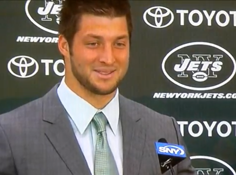 Tim Tebow was all smiles during his introductory press conference last year. (Screen grab/YouTube) 