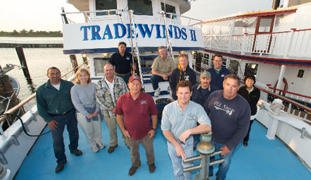 On the deck of Katherine’s boat The Tradewinds II, Katherine with current  and past Captree Fleet captains and owners.