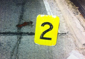 The blood stain on the street where the victim was hit before the driver fled.