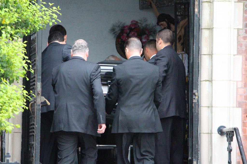 Pall Bearer's bringing Andrea Rebello's coffin into the church in Sleepy Hollow. (Photo: Rashed Mian/Long Island Press) 