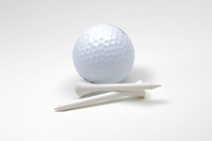 Golf Ball and Tees on White Background