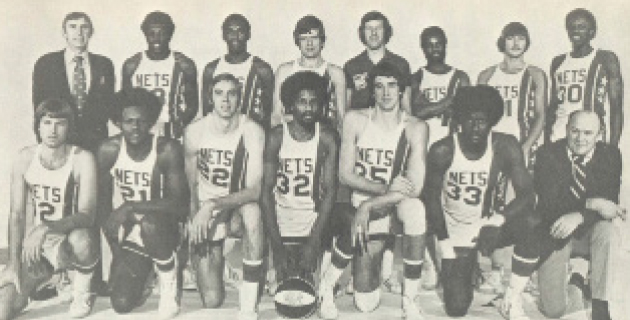 1975-76 NEW YORK NETS Front Row (left to right): Chuck Terry, Tim Bassett, Jim Eakins, Julius Erving, Kim Hughes, Rich Jones, Trainer Fritz Massman. Back Row (left to right): Owner Roy Boe, John Williamson, Ted McClain, Assistant Coach Bill Melchionni, Coach Kevin Loughery, Brian Taylor, George Bucci, Al Skinner.