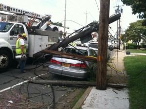 A LIPA repairman inspects damage in Elmont (LIPA photo)