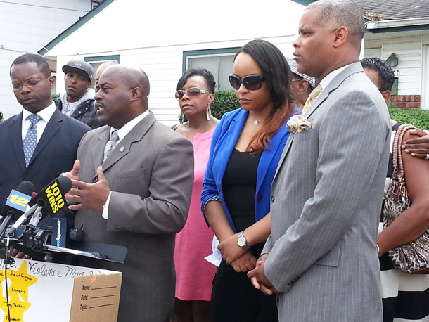 Family, friends and community activists gathered in Hempstead Friday at the scene where a 17-year-old was shot and killed. Chrissie Quinones, in blue, also made an appearance. 