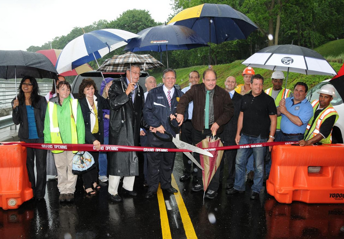 Nassau County Executive Ed Mangano joins Bayville village officials and local business owners to celebrate the reopening of West Shore Road last June. (Photo credit: Nassau County)