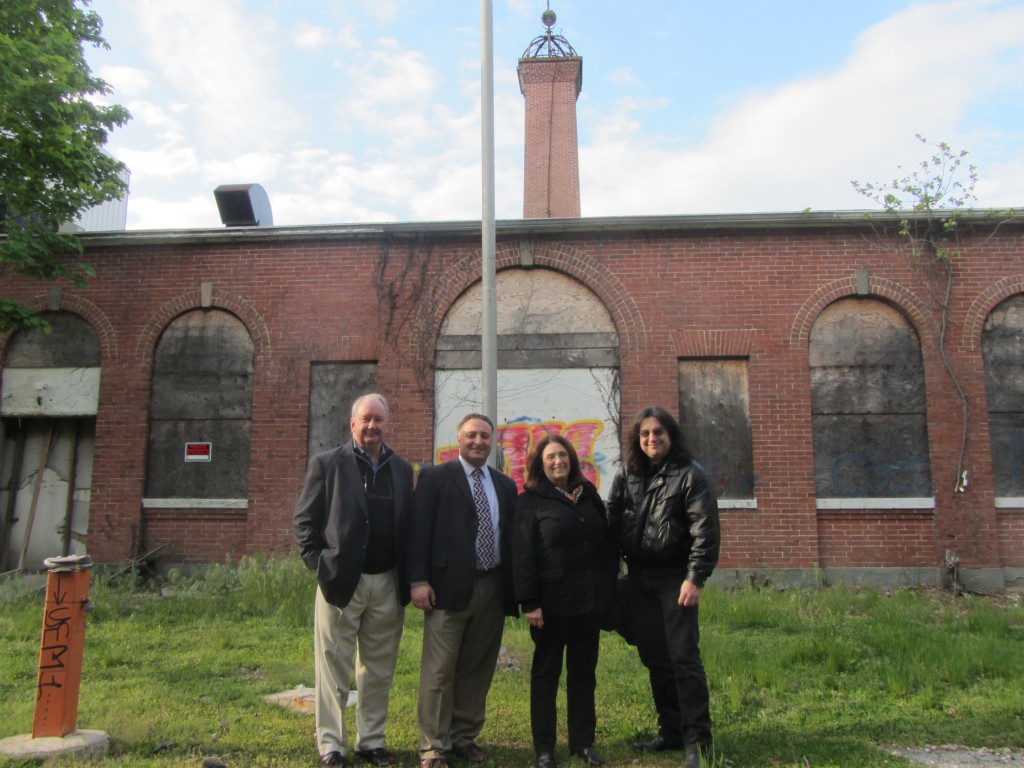 Supporters of the Tesla Science Center at Wardenclyffe in Shoreham Monday, May 13. Left to right: David Madigan, former Assemblyman Marc Alessi, Jane Alcorn, and filmmaker Joe Sikorski. (Photo credit: Spencer Rumsey/Long Island Press)