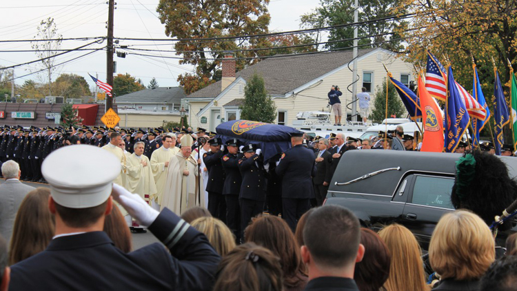 Hundreds of Nassau County police officers joined law enforcement agencies from across the region Saturday, October 27, 2012 outside St. Christopher’s Church in Baldwin to pay respects to Nassau Police Officer Arthur Lopez, who was gunned down in Bellerose Terrace after making a routine traffic stop. (Rashed Mian/Long Island Press)