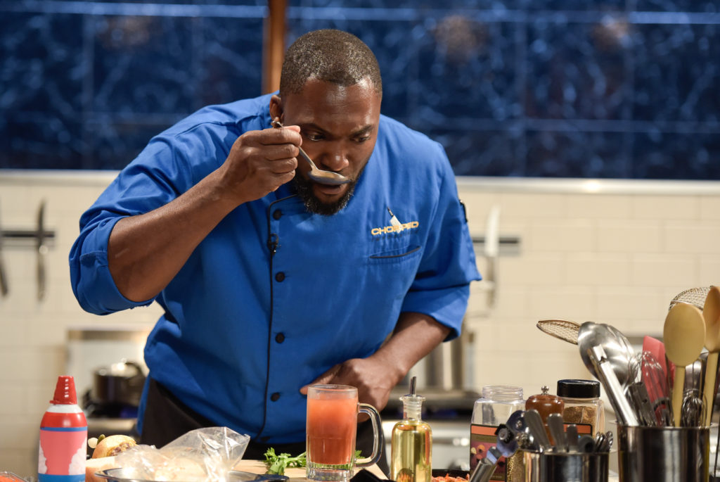 Chef Marc Anthony Bynum tastes an ingredient, as seen on Food Network’s Chopped