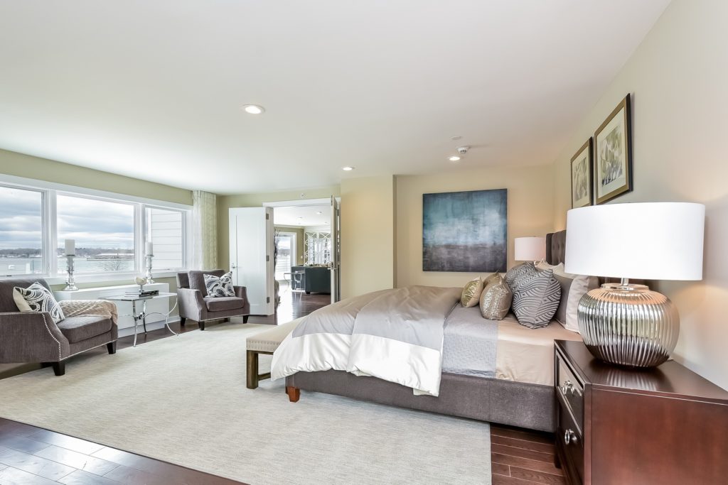 The design of the master bedroom and sitting area gives a feeling of serenity with its ocean views and elegant decor. Double doors lead into the spacious great room.