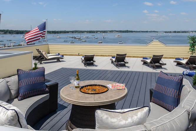 The rooftop terrace features all the amenities of outdoor dining during the daylight or under the stars.