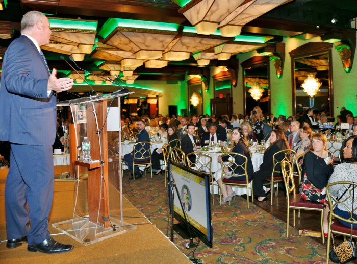 Marc Herbst speaking to crowd after accepting LICA award