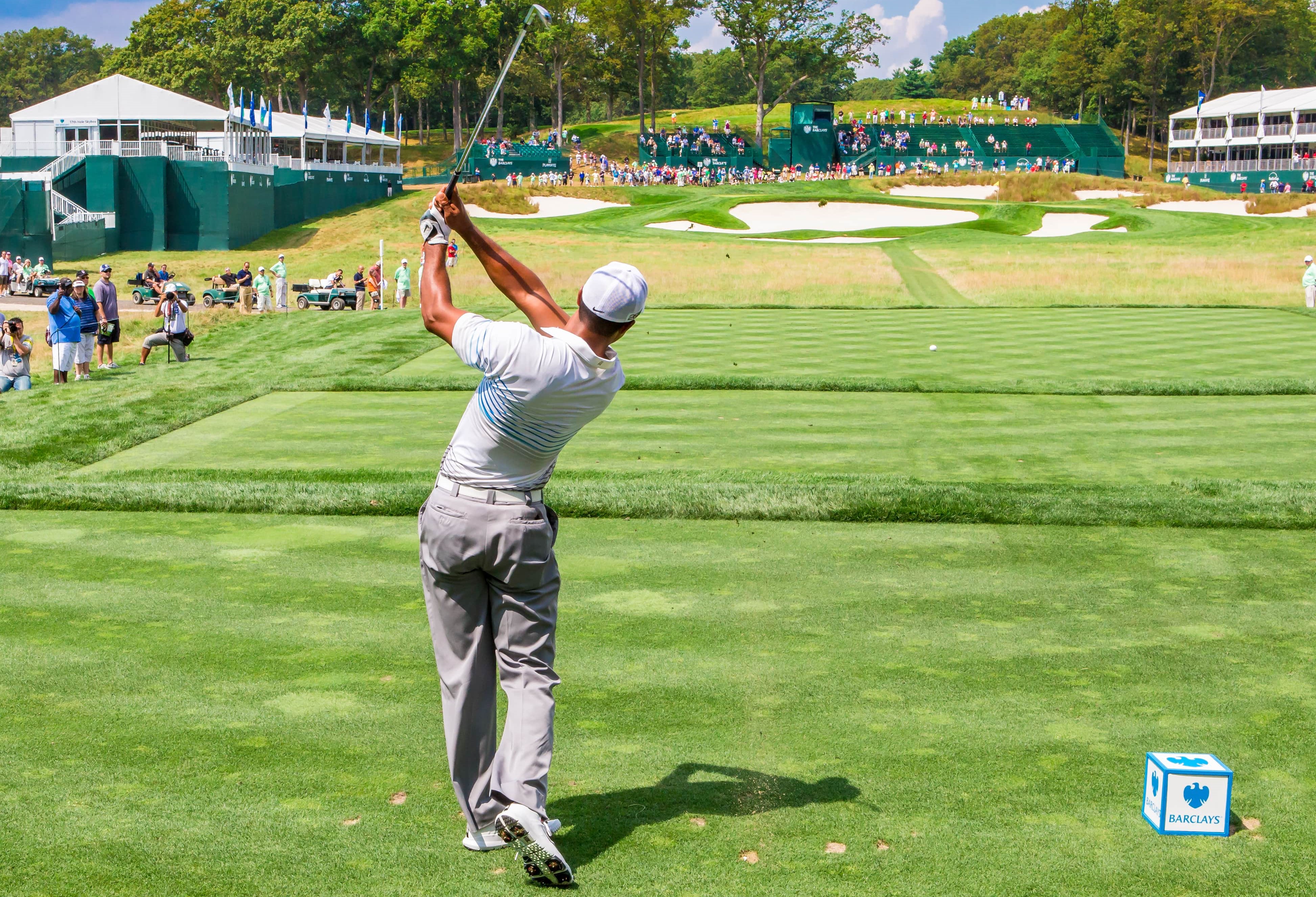 Tiger Woods hits a tee shot off the 17th hole at Bethpage Black during the Barclays on Aug. 22, 2012 in Farmingdale (Shutterstock)