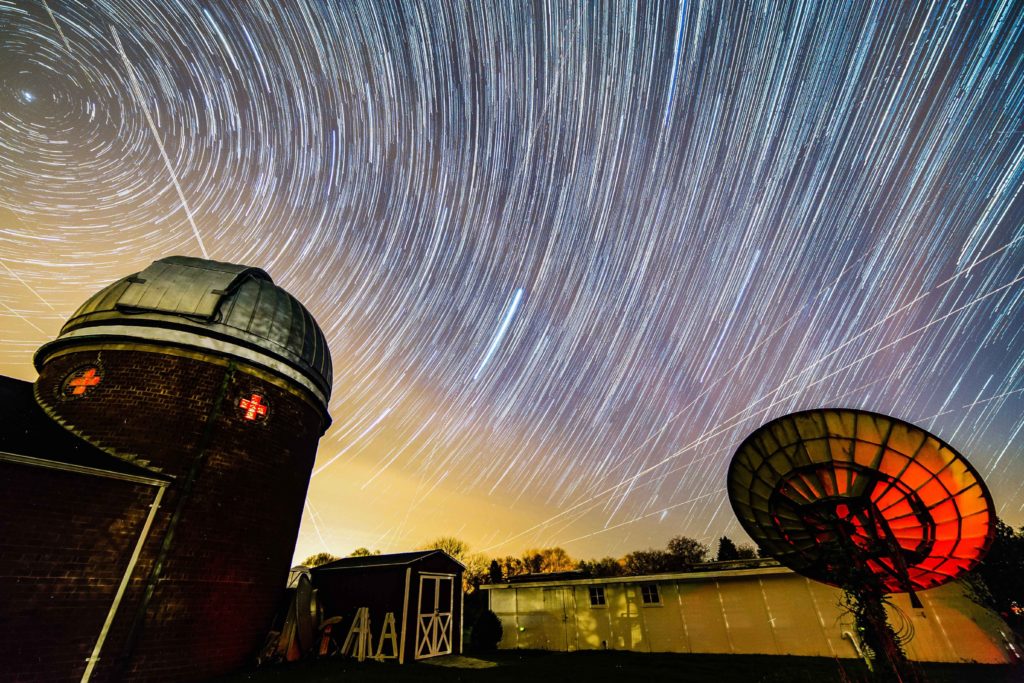 Star trails at Custer Observatory at the Custer Institute in Southold NY caused by the Earths rotation approximately 1.5 hours. Vega creates a very bright streak in the middle. 1