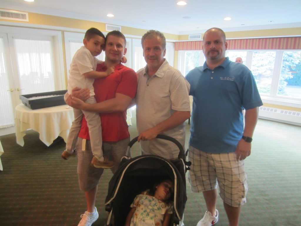 Robert Franceschini surrounded by his family sons Robert left and James right with grandchildren Martino and Debbie in stroller