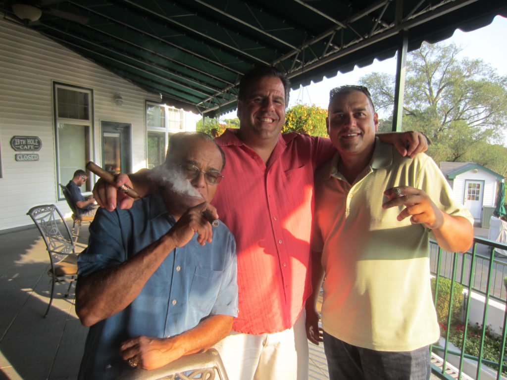 Sunshine and cigars after golf on the deck at Hempstead CC Left to right Dr. TK Ras of Woodmere Joe Pennella of Westchester and Majid Hafeez of West Hempstead.