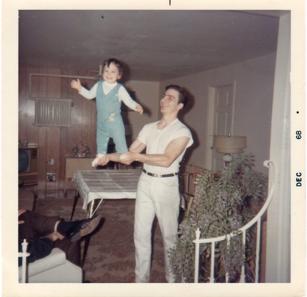 1968 balancing on Dads hands