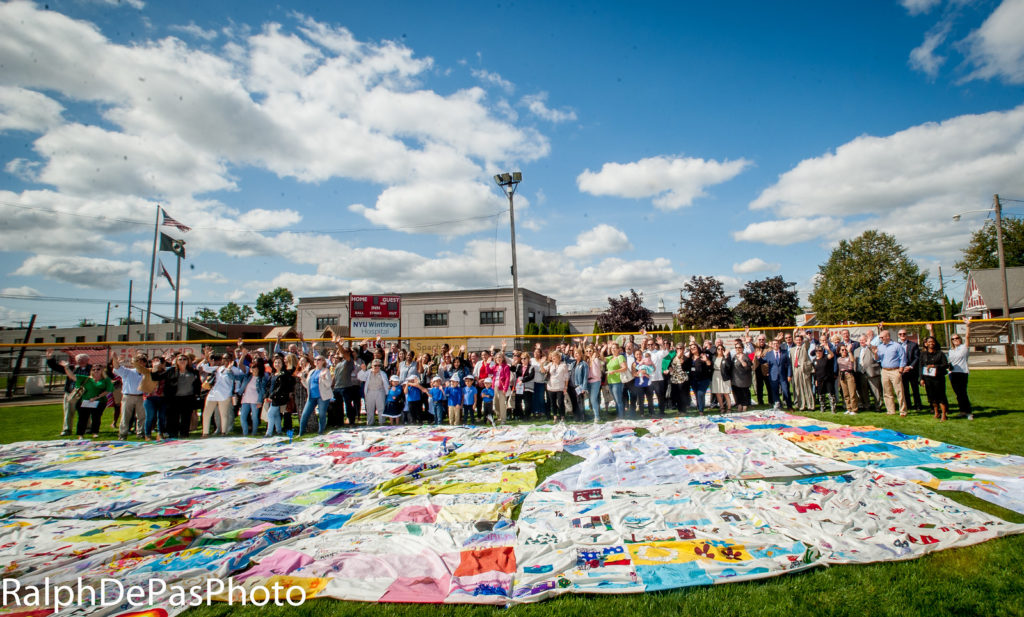 group shot with quilt