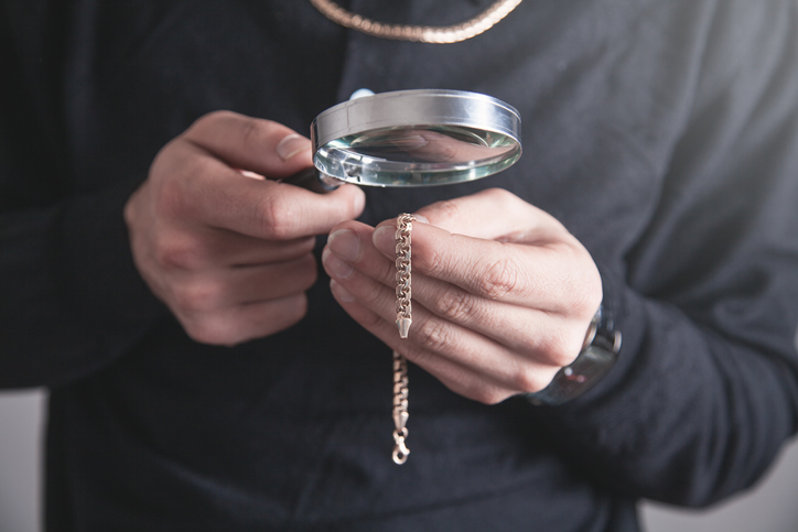 Jewelry holding magnifying glass with a bracelet.