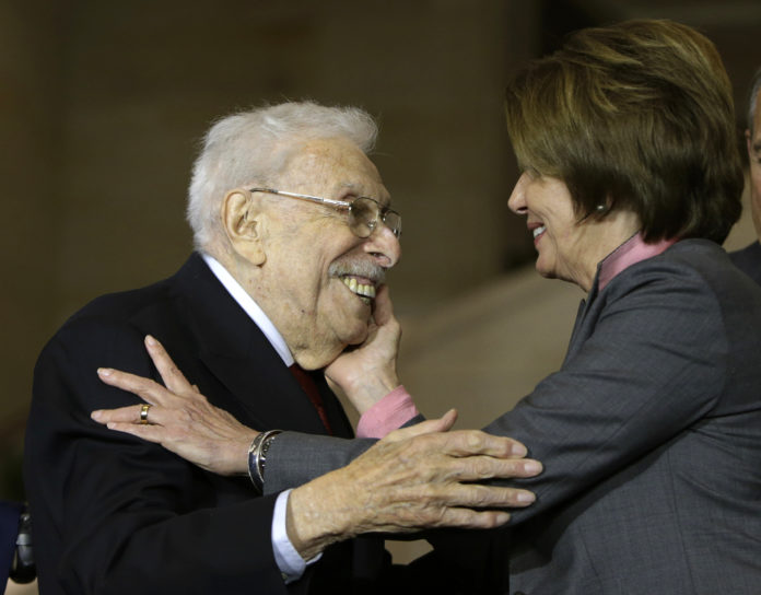 House Minority Leader Pelosi congratulates Civil Air Patrol veteran Wolff at ceremony for WWII Civil Air Patrol members in Washington lester wolff