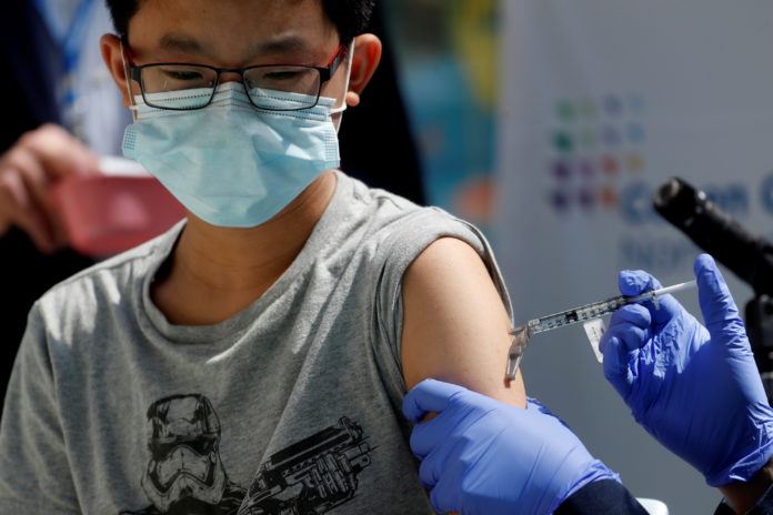 Children receive Pfizer-BioNTech vaccine for the coronavirus disease (COVID-19) in New Hyde Park, New York vaccine
