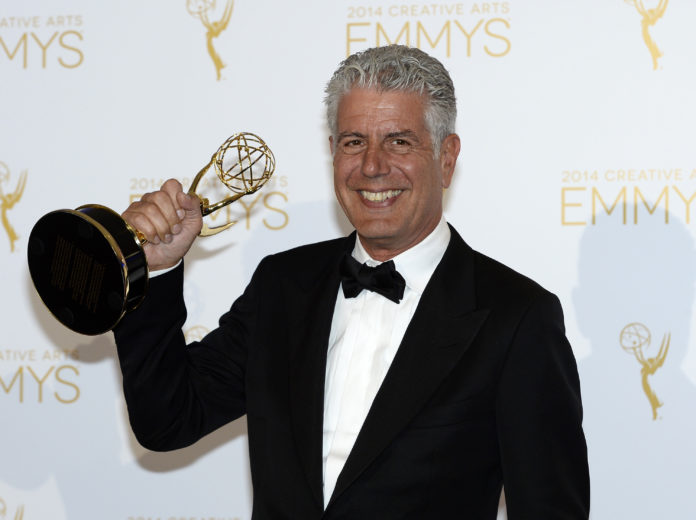Anthony Bourdain poses backstage with the Emmy for Outstanding Informational Series anthony bourdain