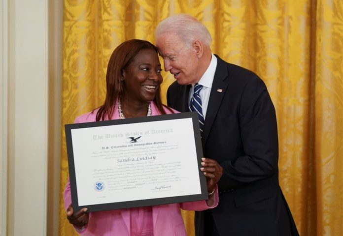 2021-07-02T194623Z_895726232_RC2JCO90V6HF_RTRMADP_3_USA-BIDEN-1200x828 lij nurse