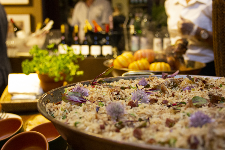 Duck rice with peas and spices in the pan.