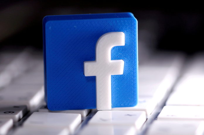 FILE PHOTO: FILE PHOTO: A 3D-printed Facebook logo is seen placed on a keyboard in this illustration facebook