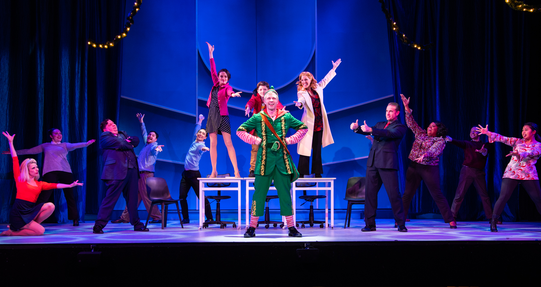 Timoth Fraser as Buddy the Elf with the cast of Elf The Musical. Photo by Russ Rowland