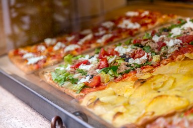 Italian pizza in a restaurant display window in Rome