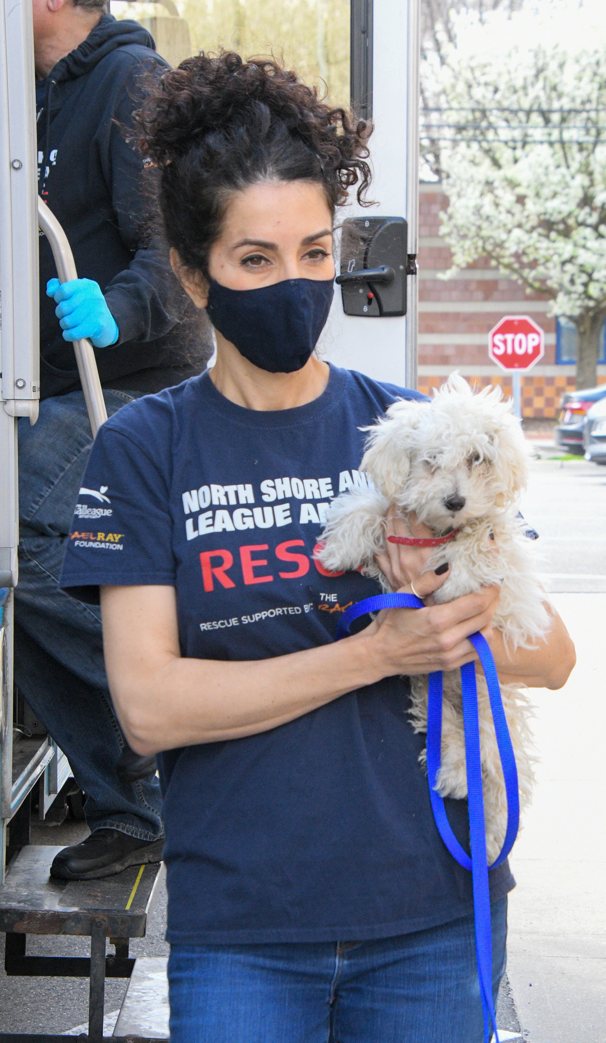 Image 16 Connie Falcone with a rescue puppy