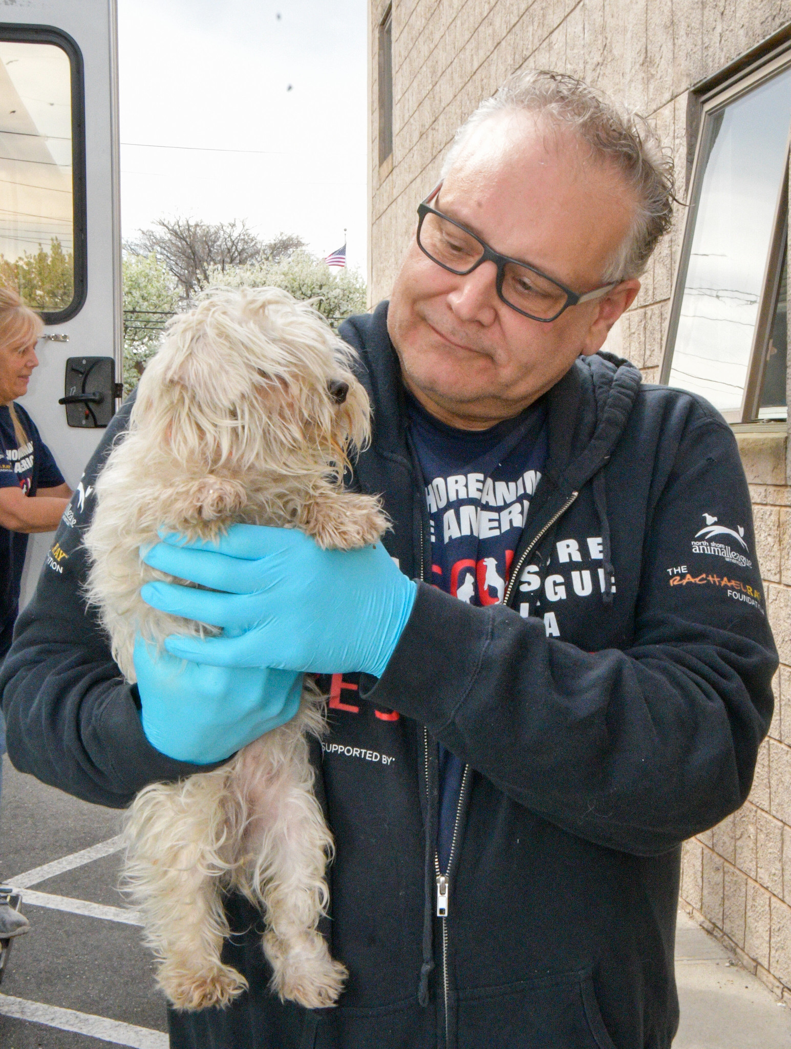 Image 3 Ted Moriates with a Puppy rescued by North Shore Animal League America and National Mill Dog Rescue