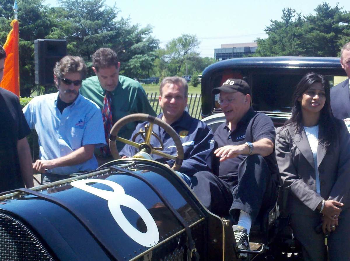 Mangano sitting in racer
