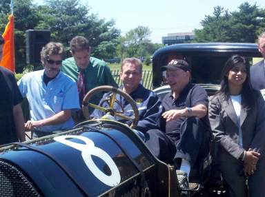 Mangano sitting in racer