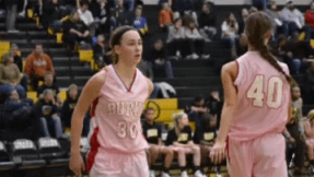 Basketball team wears pink uniforms for charity