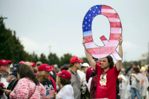 Q Anon Sign at a Trump Rally. Credit Matt Rourke. Associate Press.