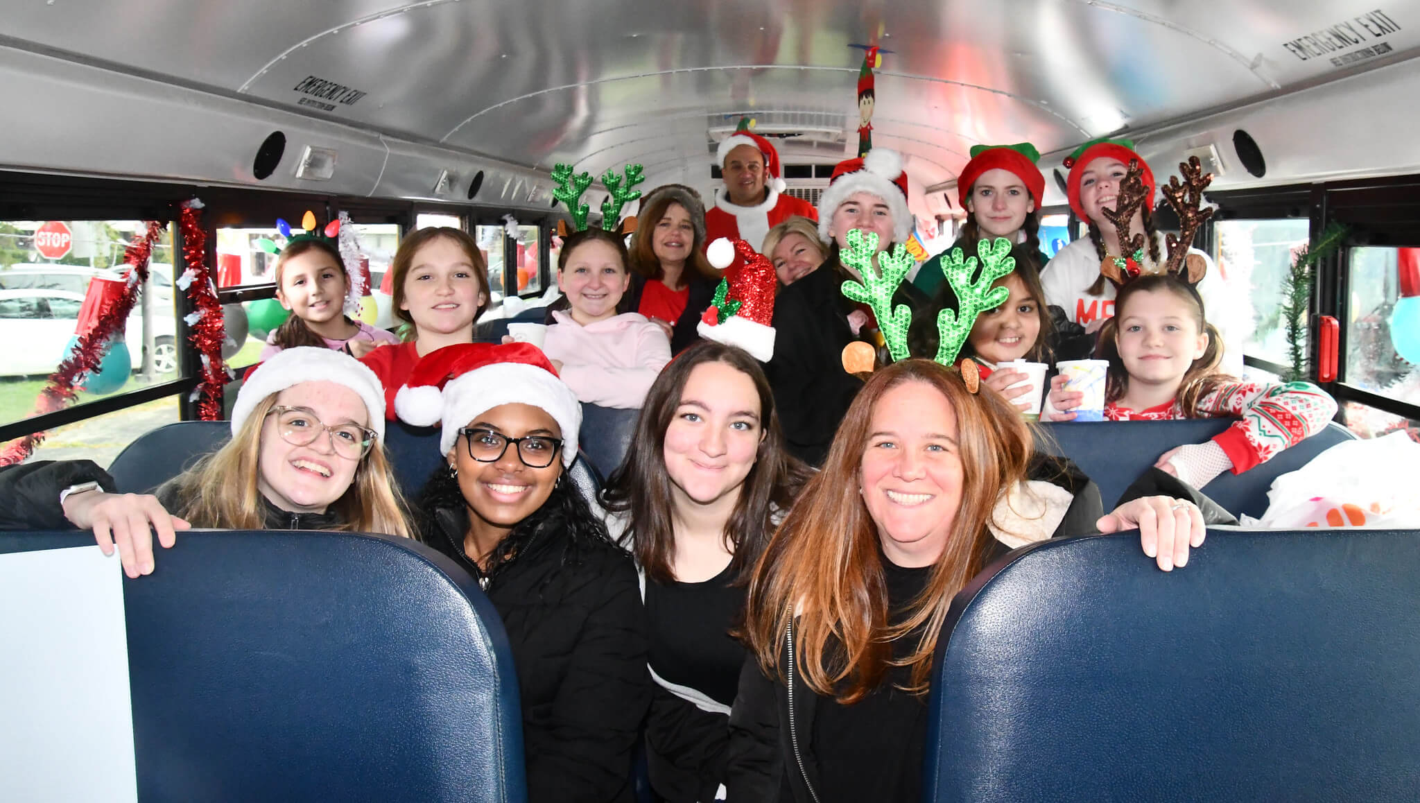 Image 14 The 8th Annual KiDS NEED MoRE Holiday Cheer Bus Elf Ride