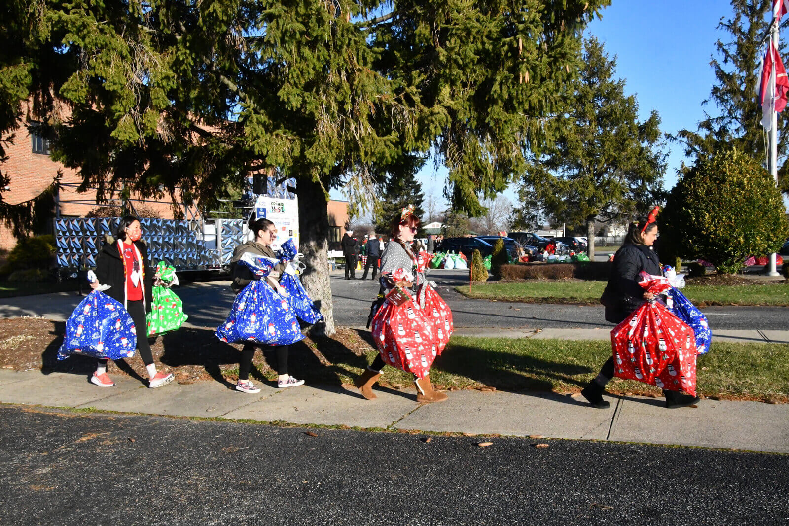 image 7 the 8th annual kids need more holiday cheer bus elf ride