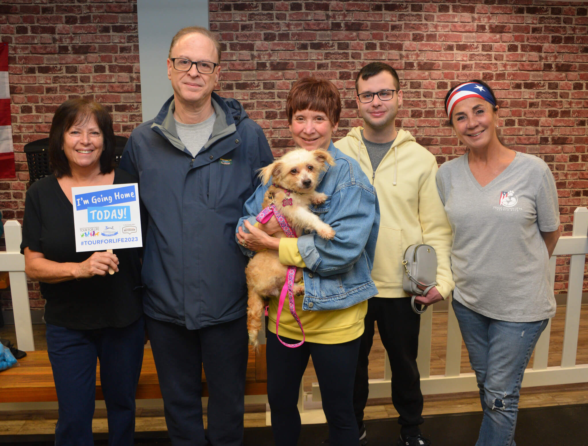 Image 3Heidi Walker Founder of Yorkie911 Rescue Inc David Wasserman Michele Wasserman Alex Wasserman adopting Abby Andrea Herrick Founder at PRoud rescuers of PR