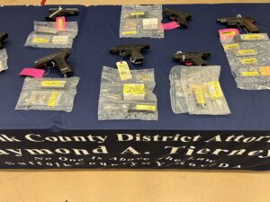 Authorities showed guns seized in a Long Island gang bust (SCDA)