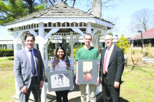 Photography students Sanaya Dhablania and Evan Garry are congratulated by Principal Dr. Giovanni Durante (left) and district coordinator of fine and performing arts Michael Salzman.